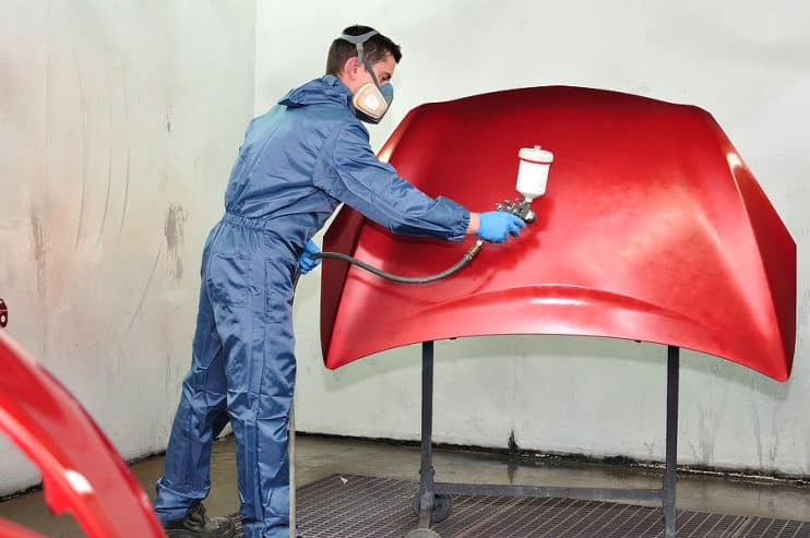 Man spraying car bonnet