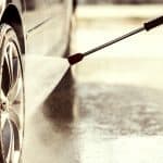 Car wheel being cleaned