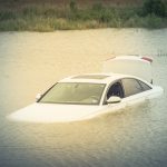 Sedan Car Swamped By Flood Water In East Houston, Texas, Us By H