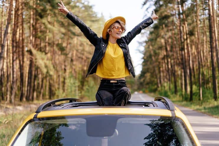 Person sitting on sunroof