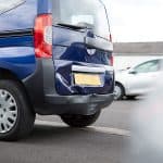 Detail Of Damage To Rear Bumper Of Vehicle In Car Park