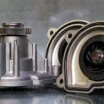 Coolant Pump Of A Modern Car On A Steel Background. Shown From T