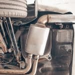 Close Up Of Car Exhaust System Pipe At The Garage, Automotive Ca