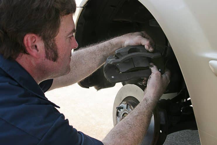 Brake pads being replaced