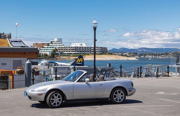 Silver Mzda MX-5 parked by harbour